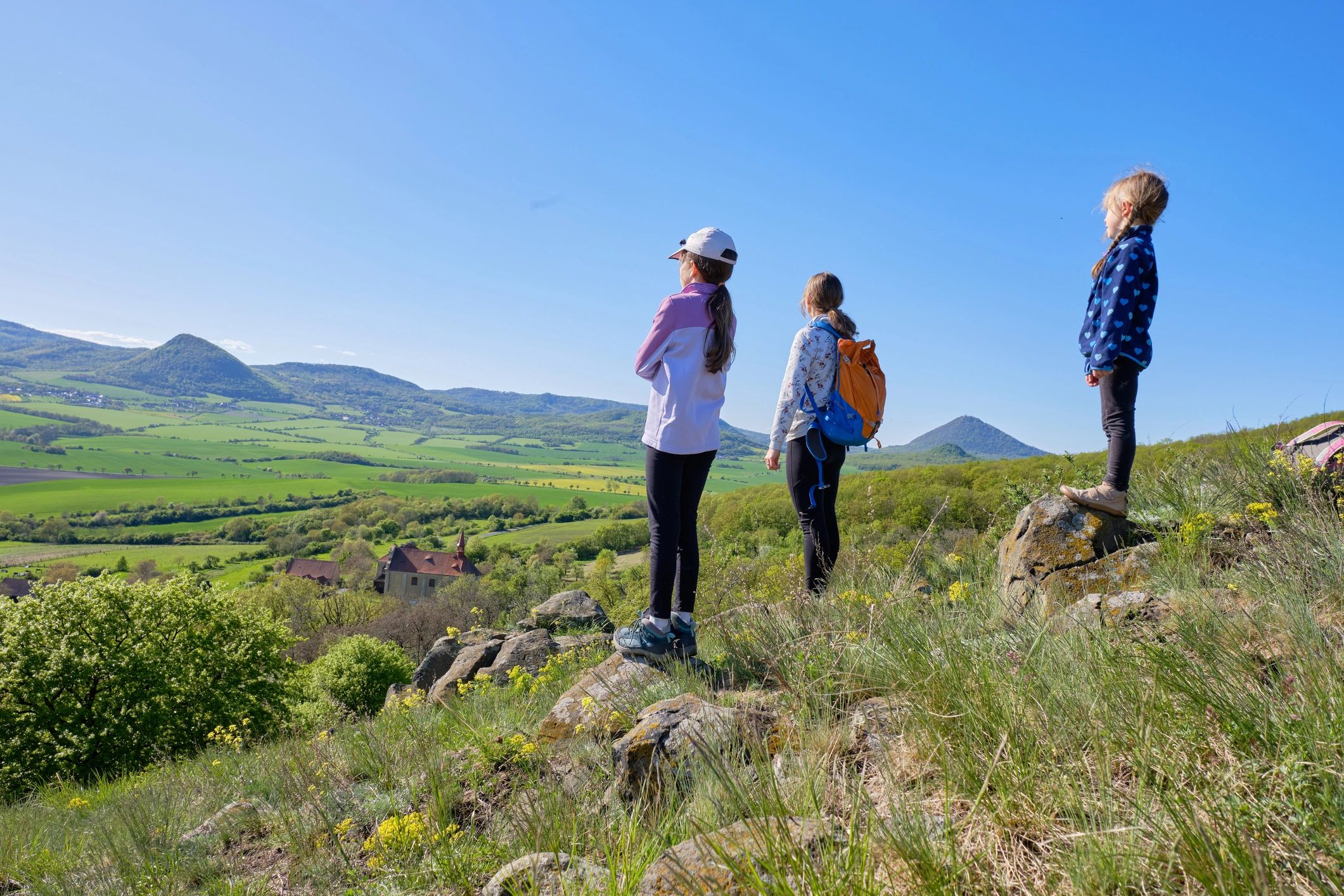 Travelers hiking with panoramic valley views